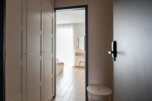 a door leading to a room with a bedroom at Bieślin 41 in Bieślin +18 photos