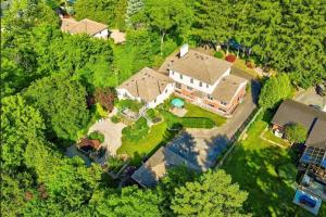 an aerial view of a large house in the forest at Charlotte Garden Bed and Breakfast in Niagara-on-the-Lake