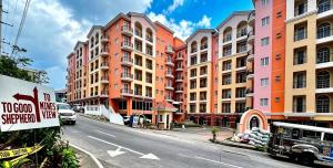 a street with tall buildings on a city street at 3Bedroom unit in MinesView Park Free Parking in Baguio