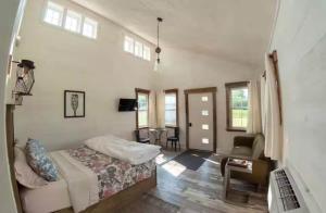 a bedroom with a bed and a desk in a room at The Ridgeline | Near Saddleback • Walk to Rangeley Lake in Rangeley