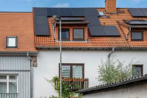 a house with solar panels on the roof at Reihenhaus Römmer in Altenstadt