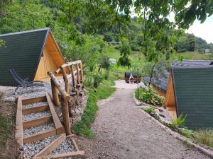 a path leading to a house with a wooden fence at Pr' Končovc - wooden tent in Kranj