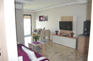 Et tv og/eller underholdning på Luksusowy Apartament Solevento