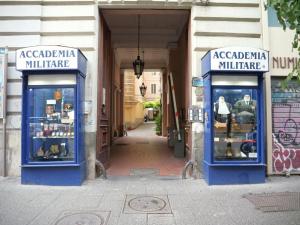two shops with blue doors on a street at MAMALU - Studios and Suites in Naples