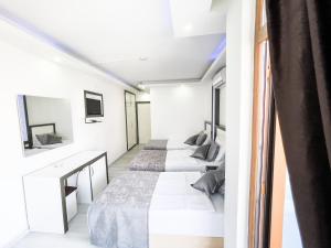 a row of beds in a room at Livane Sun Otel in Alanya
