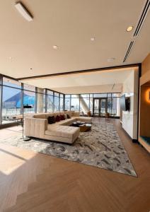 a large living room with a couch and a rug at Atl oasis in Atlanta