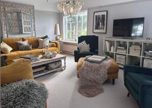 a living room with a couch and a table at Copeland House 4 Island Wall in Whitstable