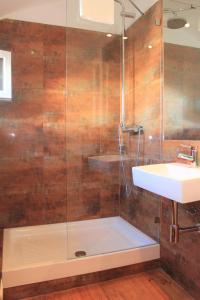 a bathroom with a shower and a sink at Charming Duplex- Príncipe Real in Lisbon