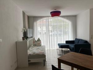a living room with a couch and a table at Ferienwohnung Zweinig 06 in Zweinig