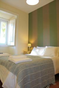 En eller flere senge i et værelse på Charming Duplex- Príncipe Real