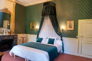 a bedroom with a bed with a canopy at Château de Mons Gard in Mons