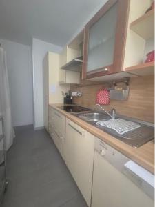 a kitchen with a sink and a counter top at Paradise Jungle in Paradiso +6 photos