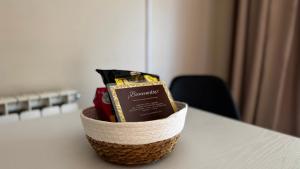 a basket sitting on a table with some food at Hotel Restaurant Europeu in Montmeló