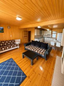 a living room with a couch and a table at Ena Suites in Çaykara