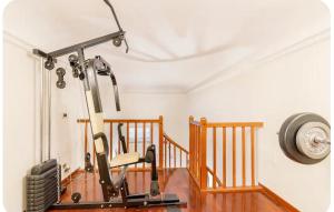 a home gym with a treadmill next to a staircase at queen 24 in Taranto