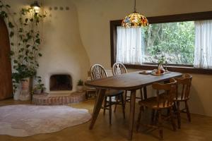 a dining room with a table and chairs and a fireplace at 공간서시 in Chin-dong +49 photos