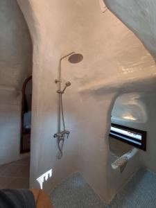 a bathroom with a shower with a mirror on the wall at 공간서시 in Chin-dong