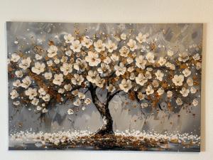 a painting of a tree with white flowers at Ferienwohnung "Große Auszeit" in Schongau +11 photos