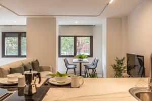 a living room with a couch and a table at Royar Apartamentos in Jaén