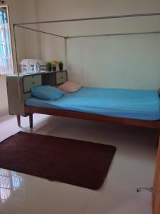 a bunk bed in a room with a rug at Paras home in Deoghar