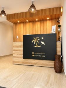 a lobby with a screen with a spider on it at Pousada Maragobeach Suits in Maragogi