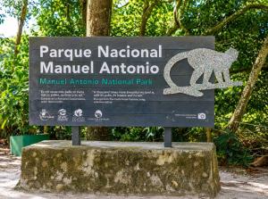 a sign for a park with a bear on it at Casa Emma Quepos in Quepos +36 photos