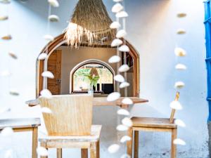 a room with a bunch of mushrooms on the wall at Old Stone Boutique Lodge in Bagamoyo