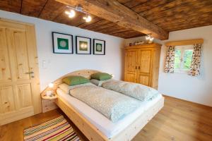 a bedroom with a bed in a room at Ferienhaus Sterzhansl in Pongratzen +17 photos
