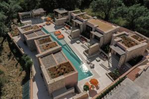 an aerial view of a house with a swimming pool at NINEMO Village in Fternón