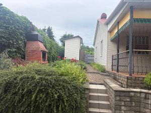 a house with a walkway next to a building at Дом у моря in Odesa