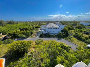 an aerial view of a white house with trees at Bliss home in Watamu