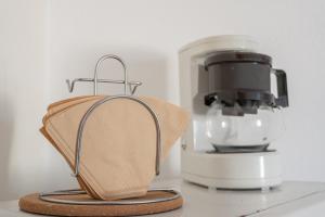 a food processor with a cloth next to it at BEB House Ulcinj in Donji Štoj