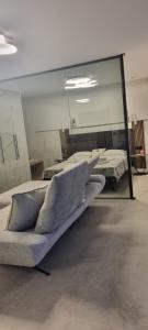 a mirror in a room with several mattresses at House K and M in Pag