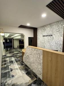 a reception area of a hotel with a reception desk at Ydora Luxury Hotel in Bodrum City