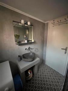 a bathroom with a sink and a mirror at John and Tania's Garden in Prinos +43 photos