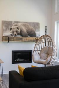a bear laying on a shelf in a living room at Le Clorane spa relax in Chertsey