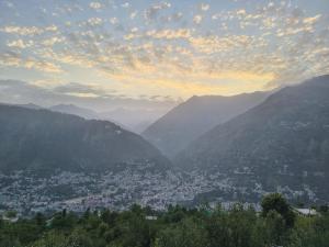 a view of a city in the mountains at Himalayan Whisper in Kulu