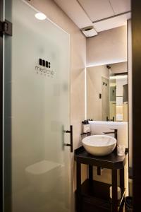 a bathroom with a sink and a toilet at Medichë Rooms General Ricardos in Madrid +36 photos