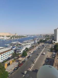 a view of a city with a river and a street at Nile Hotel in Aswan