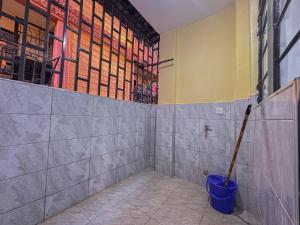 a room with a blue bucket on the wall at Riverview greenstar cozy homes in Kisii