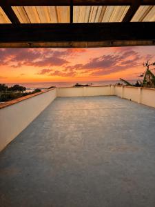 a view from the roof of a house with a sunset at Sharks View in Port Shepstone +15 photos