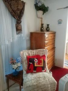 a bedroom with an elephant pillow and a dresser at WELCOME TO My COTTAGE in Sunland