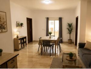 a living room with a table and a couch at Villa131 Hotel in Cairo