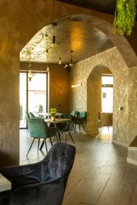 a dining room with a table and chairs at Casa Braneana in Bran