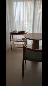 a table and a chair in front of a window at Camere DOMOVIEW- design con vista su Cammarata in San Giovanni Gemini +22 photos
