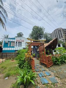 a resort with a garden and a building at Coastal daisy Beach resort in Cox's Bazar +13 photos