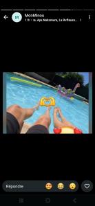 a picture of a person in a swimming pool at Espace naturel in La Tour-de-Salvagny