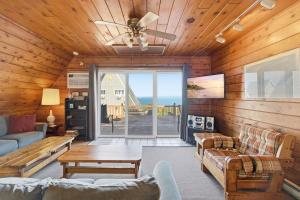 a living room with a view of the ocean at Chalet #17 in Stevensville