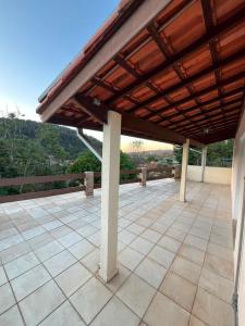 a pavilion with a wooden roof on a patio at Casa Carregosa in São Roque