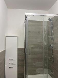 a shower with a glass door in a bathroom at Nova Stay in Rome +34 photos